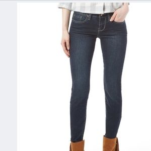 Dark wash distressed pocket skinny jeans